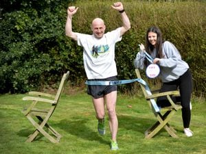 Darren Bentley from Burntwood ran a marathon in his garden on Sunday, 875 laps of his garden, taking him almost six hours.He is pictured with his daughter Eve, aged 15