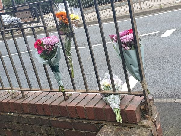 Four floral tributes were left on a set of railings on Thorns Road