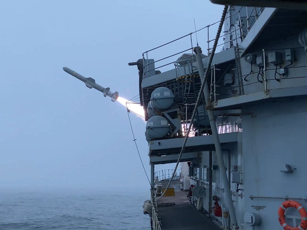 HMS Westminster firing Harpoon missiles at ex-USS Boone