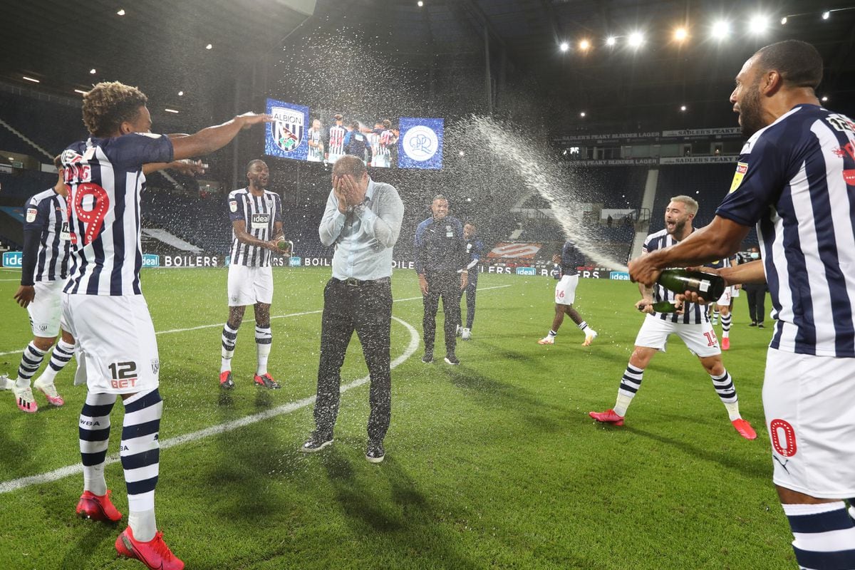 Manager Slaven Bilic is soaked in champagne after the final whistle. Photo: AMA