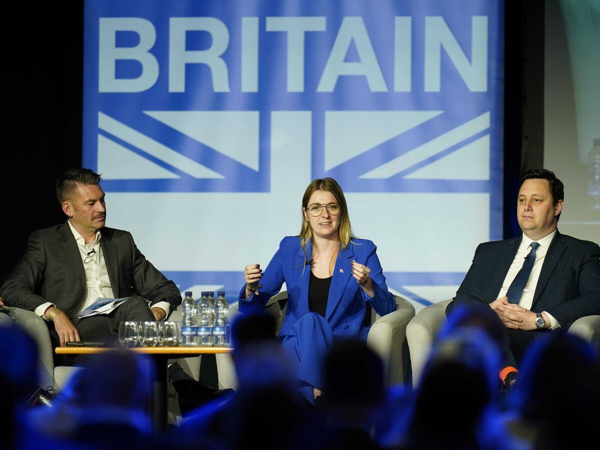 Left to right, Ed Taylor, director of public affairs, CityFibre, Dehenna Davison parliamentary under secretary of state for levelling up, and Ben Houchen, Tees Valley mayor, on stage during the Northern Research Group conference at Doncaster Racecourse