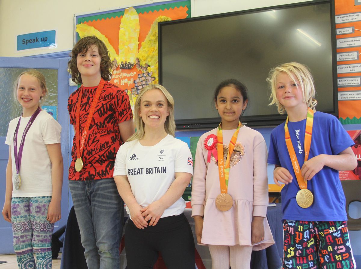 Shrubbery School pupils got to try on Ellie Simmonds’ gold, silver and bronze medals when she visited to give an inspirational talk.