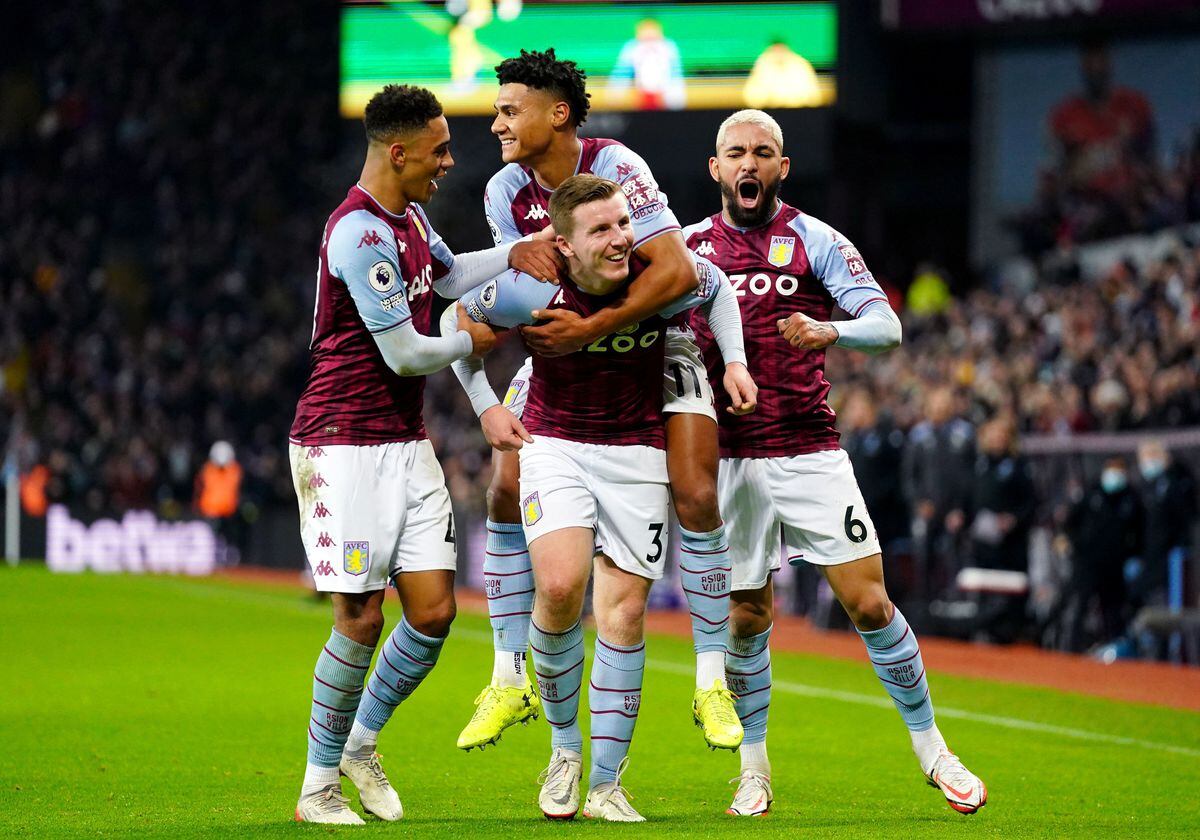 
              
Aston Villa's Matt Targett (bottom) celebrates with his team-mates after Chelsea's Reece James (not pictured) scores an own goal during the Premier League match at Villa Park, Birmingham. Picture date: Sunday December 26, 2021. PA Photo. See PA story SOCCER Villa. Photo credit should read: Nick Potts/PA Wire.
 

RESTRICTIONS: EDITORIAL USE ONLY No use with unauthorised 
audio, video, data, fixture lists, club/league logos or "live" services. Online in-match use limited to 120 images, no video emulation. No use in betting, games or single club/league/player publications.
            
