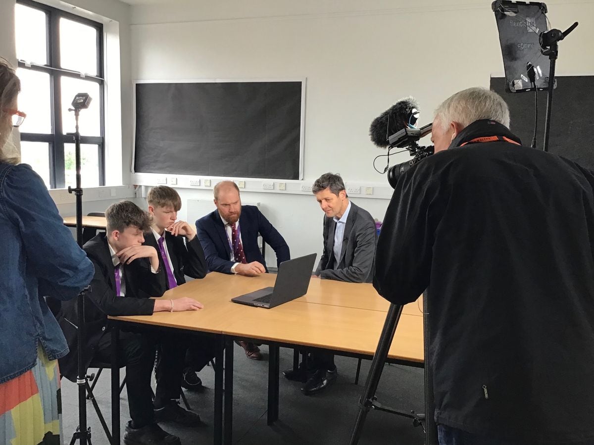 BBC health editor Hugh Pym interviewing Baxter College principal Matthew Carpenter and students Leon May and Oscar Whatmore