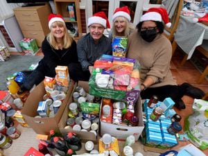 Justine Rogers, Tom Luxton, Claire Collins and Nikki Denning with donations for the Feed a Family This Christmas campaign