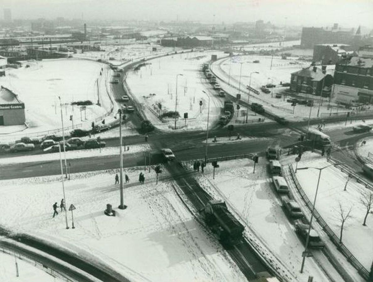 A bird's eye view of a section of Wolverhampton's snowy ring road shows 