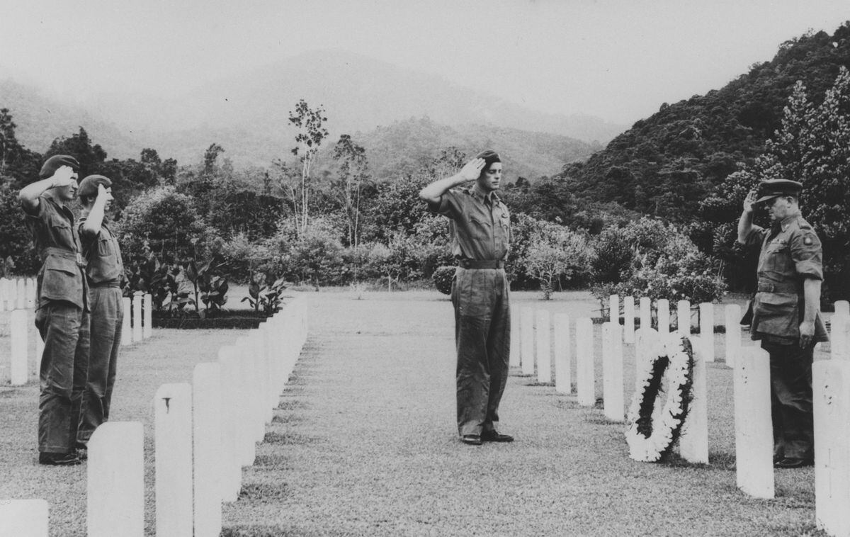Soldier attending the grave of Scarf postwar