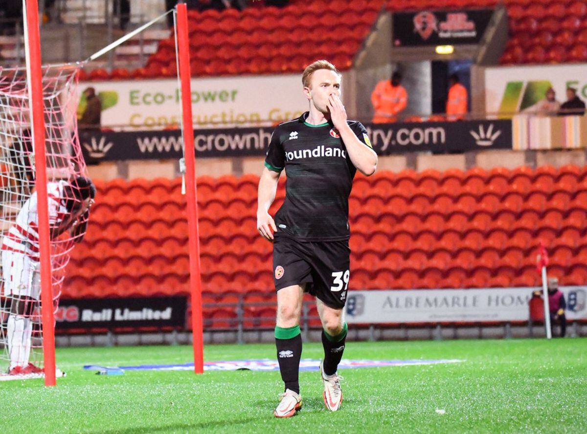 Danny Johnson celebrates in front of the travelling fans after grabbing a second (Owen Russell)