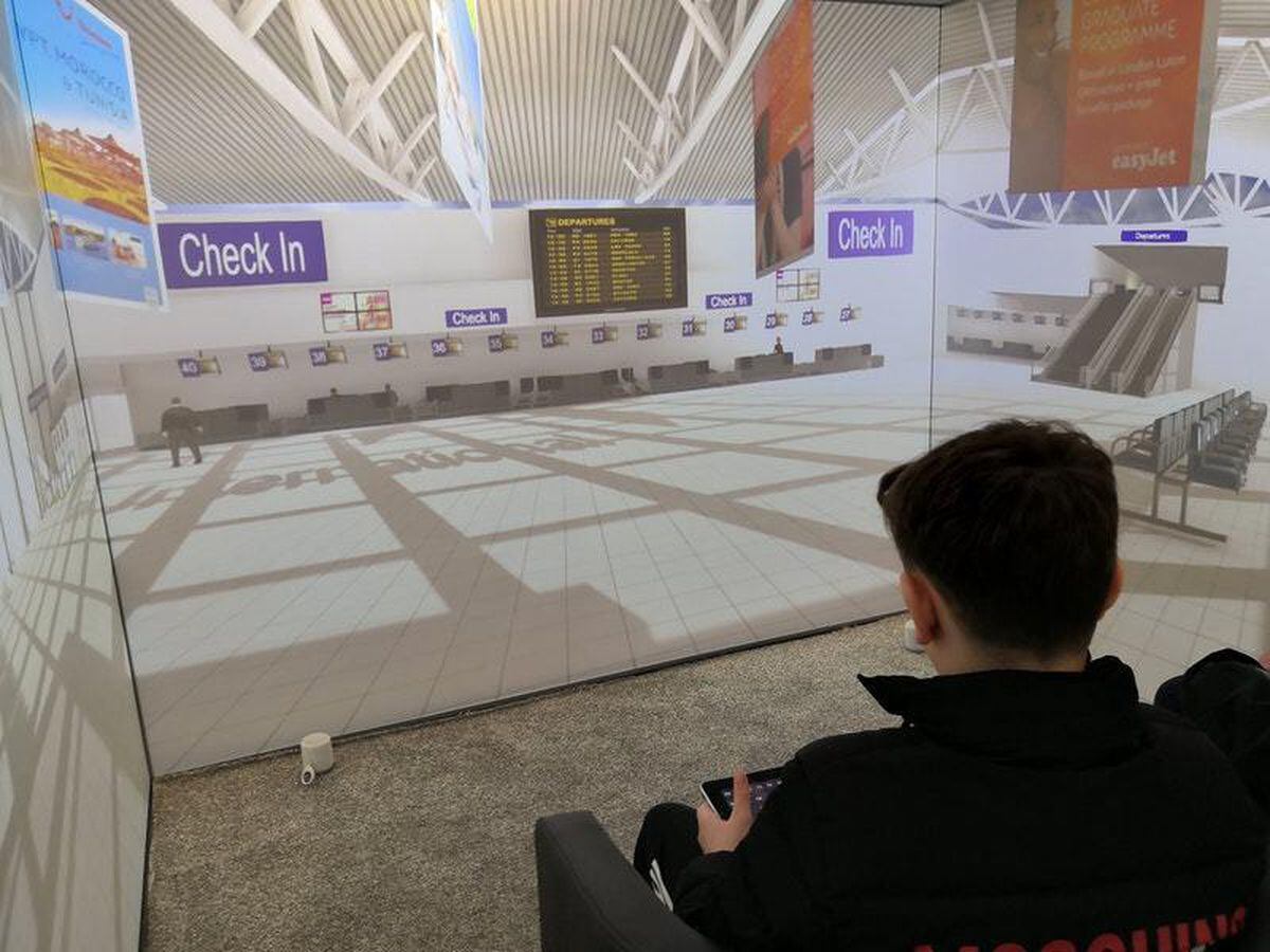 A child uses the Blue Room Virtual Reality suite to safely confront his fear of flying