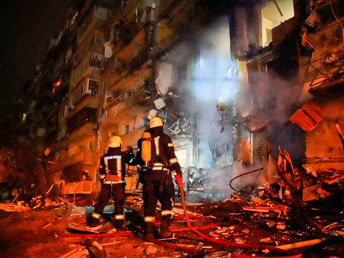 Firefighters inspect the damage at a building following a rocket attack on the city of Kyiv, Ukraine, Friday. Photo: Ukrainian Police Department Press Service via AP