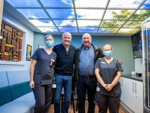 Steve Bull and Phil Oaten with two nurses from Compton Care