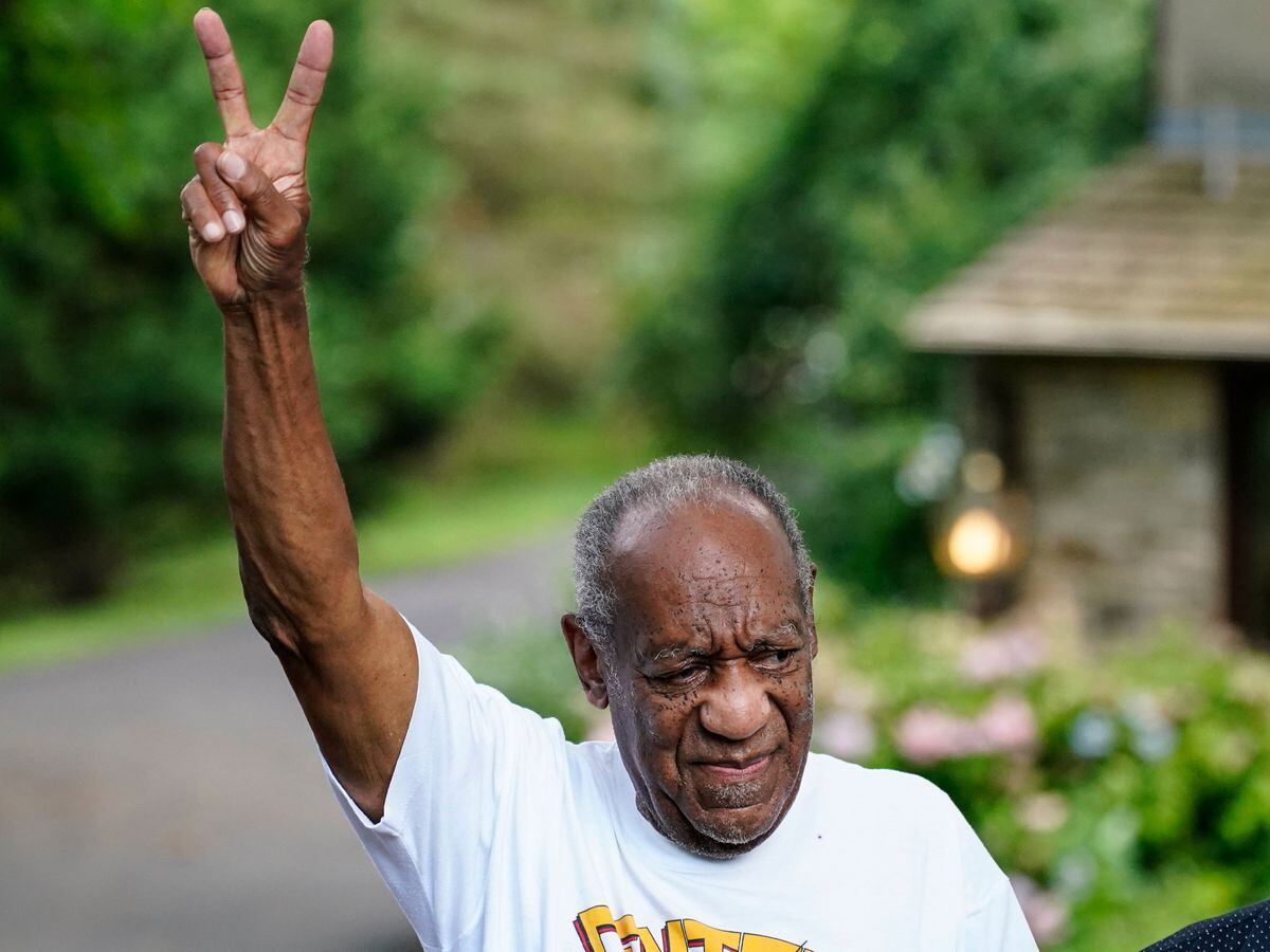 Bill Cosby gesturing outside his home, after being released from prison (Matt Rourke/AP)