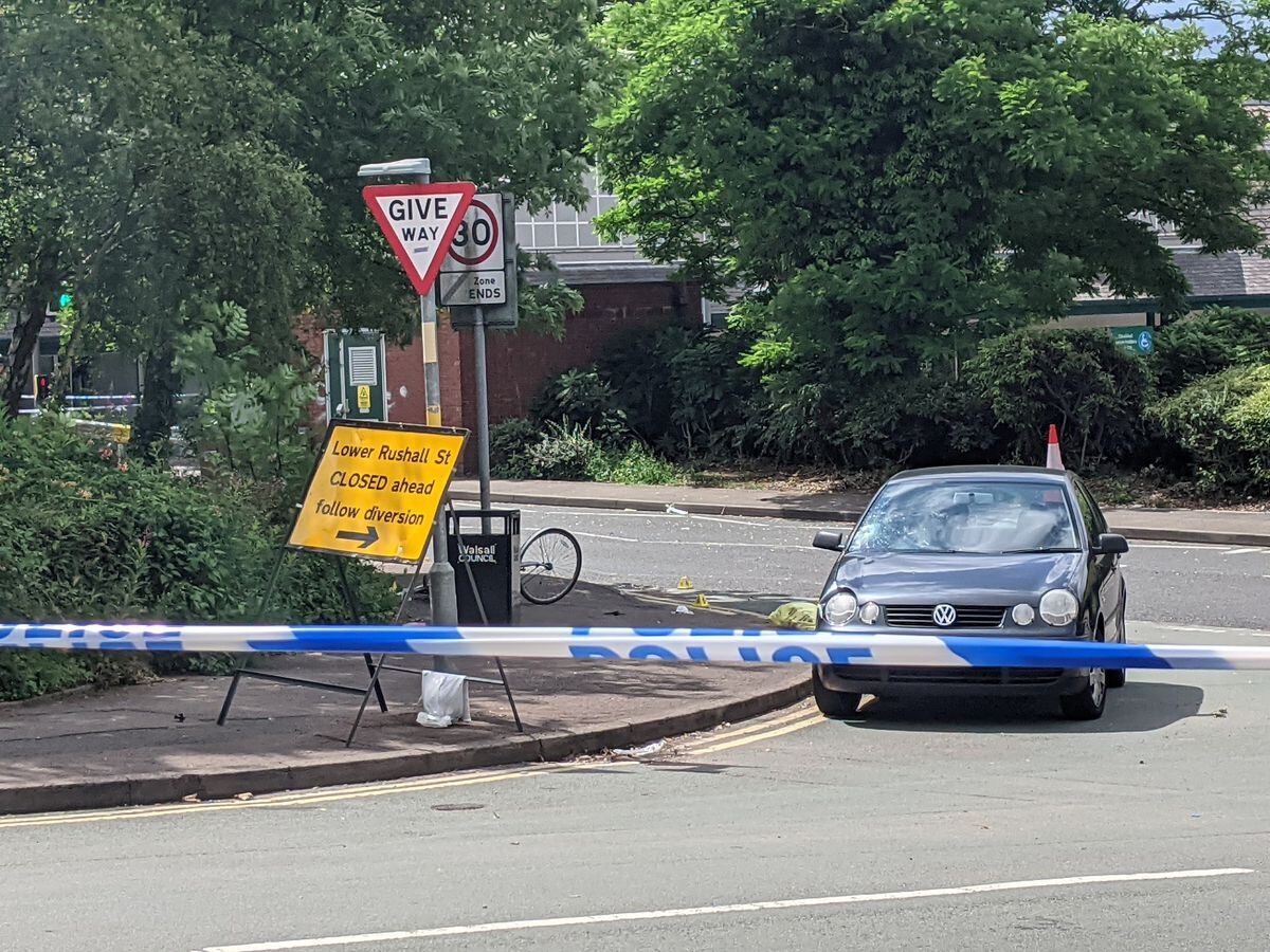 A VW Polo and bicycle behind the police cordon at the junction of Lower Rushall Street and Walhouse Road in Walsall