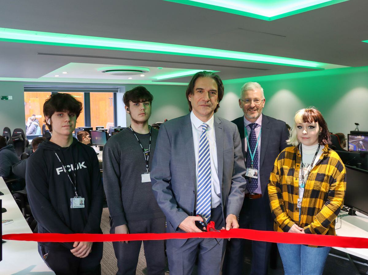 James Morris with students officially opened the library 
