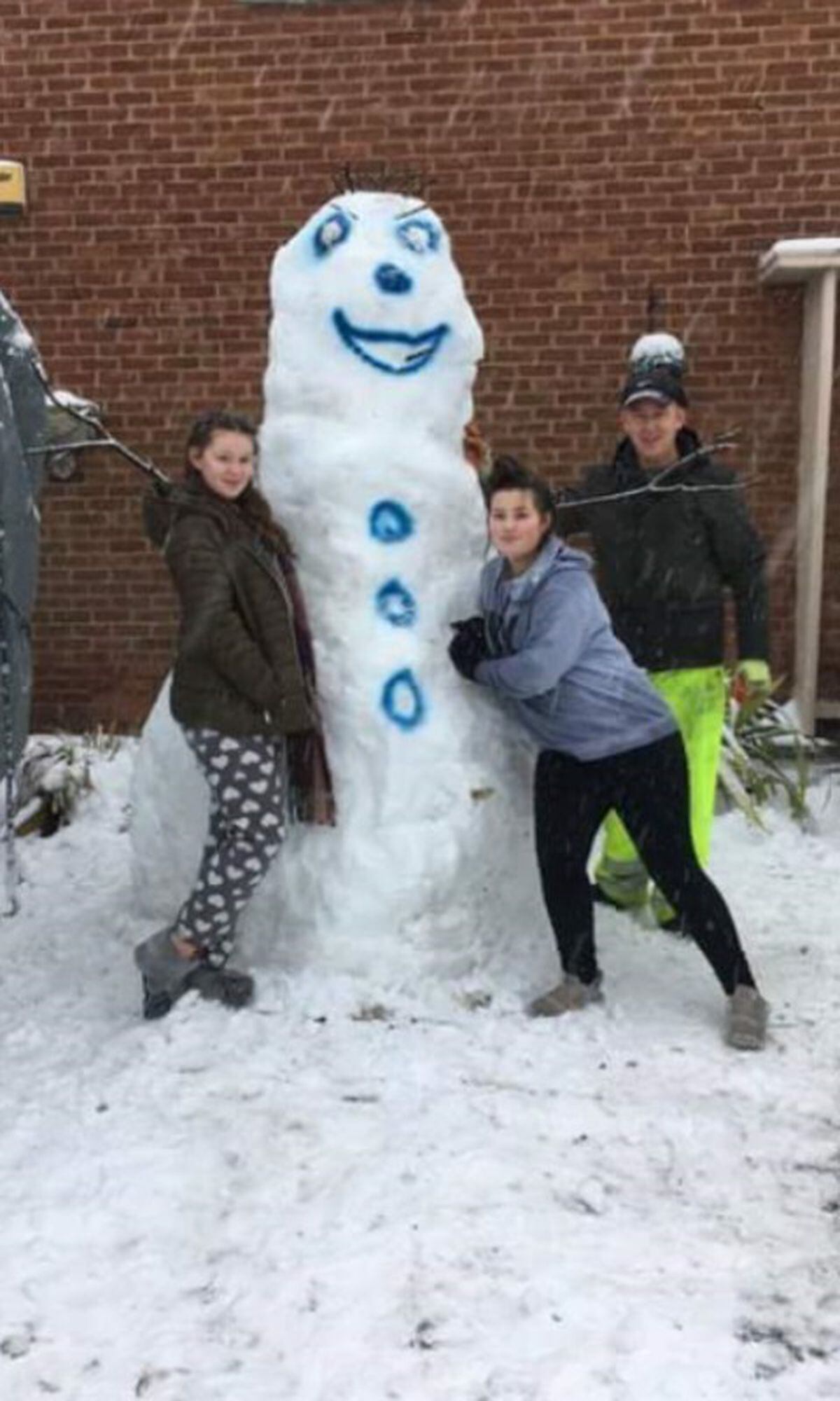 The Collins family from Willenhall with their snowman