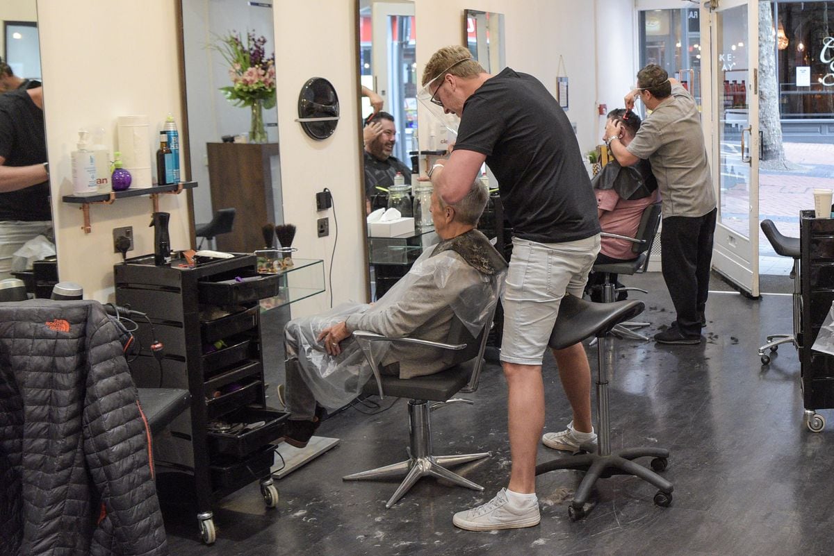 Customers get a long-awaited haircut at Urban Roots in Birmingham. Photo: SnapperSK