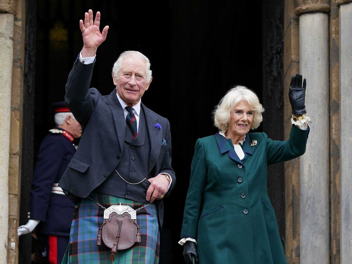 King Charles III and the Queen Consort wave as they leave Dunfermline Abbey after a visit to mark its 950th anniversary, and after attending a meeting at the City Chambers in Dunfermline, Fife, where the King formally marked the conferral of city status on the former town