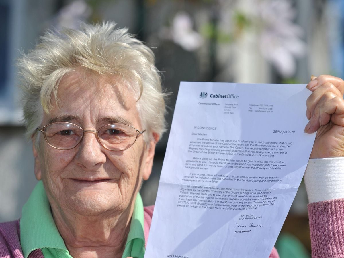 Ann Nightingale with her letter telling her of her MBE.