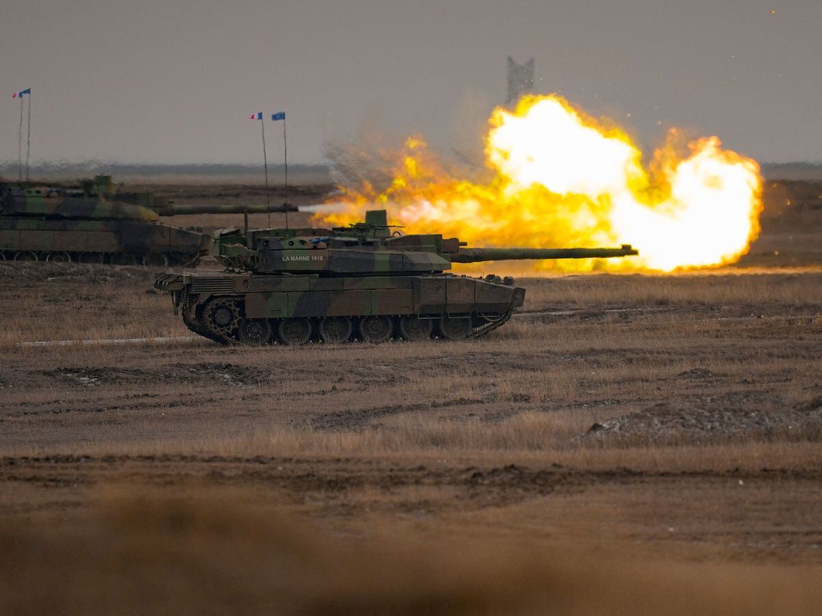 A French Leclerc main battle tank shoots during an exercise at a training range in Smardan, eastern Romania