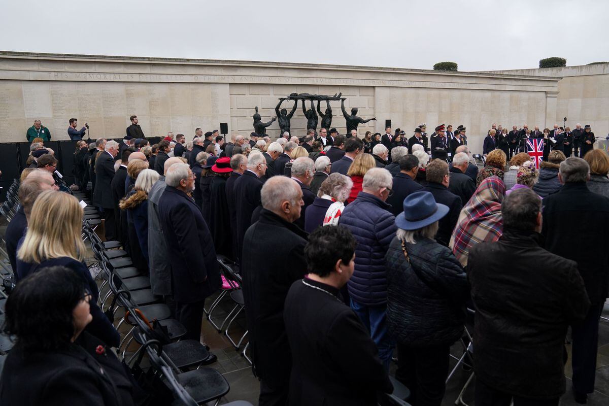 People observe a two minute silence to remember the war dead on Armistice Day at the Armed Forces Memorial, at the National Memorial Arboretum, in Alrewas, Staffordshire