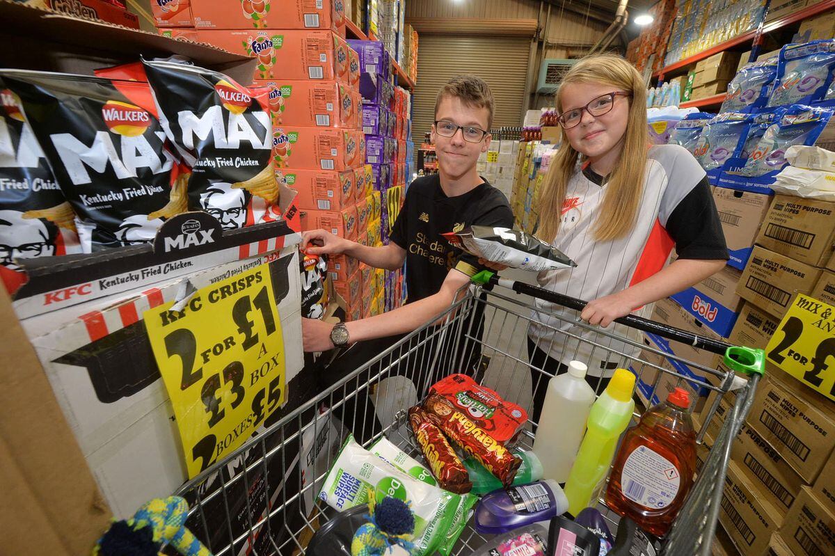 Lacey Wood, 11, and Jai Wood, 15, from Hednesford getting some goodies. 