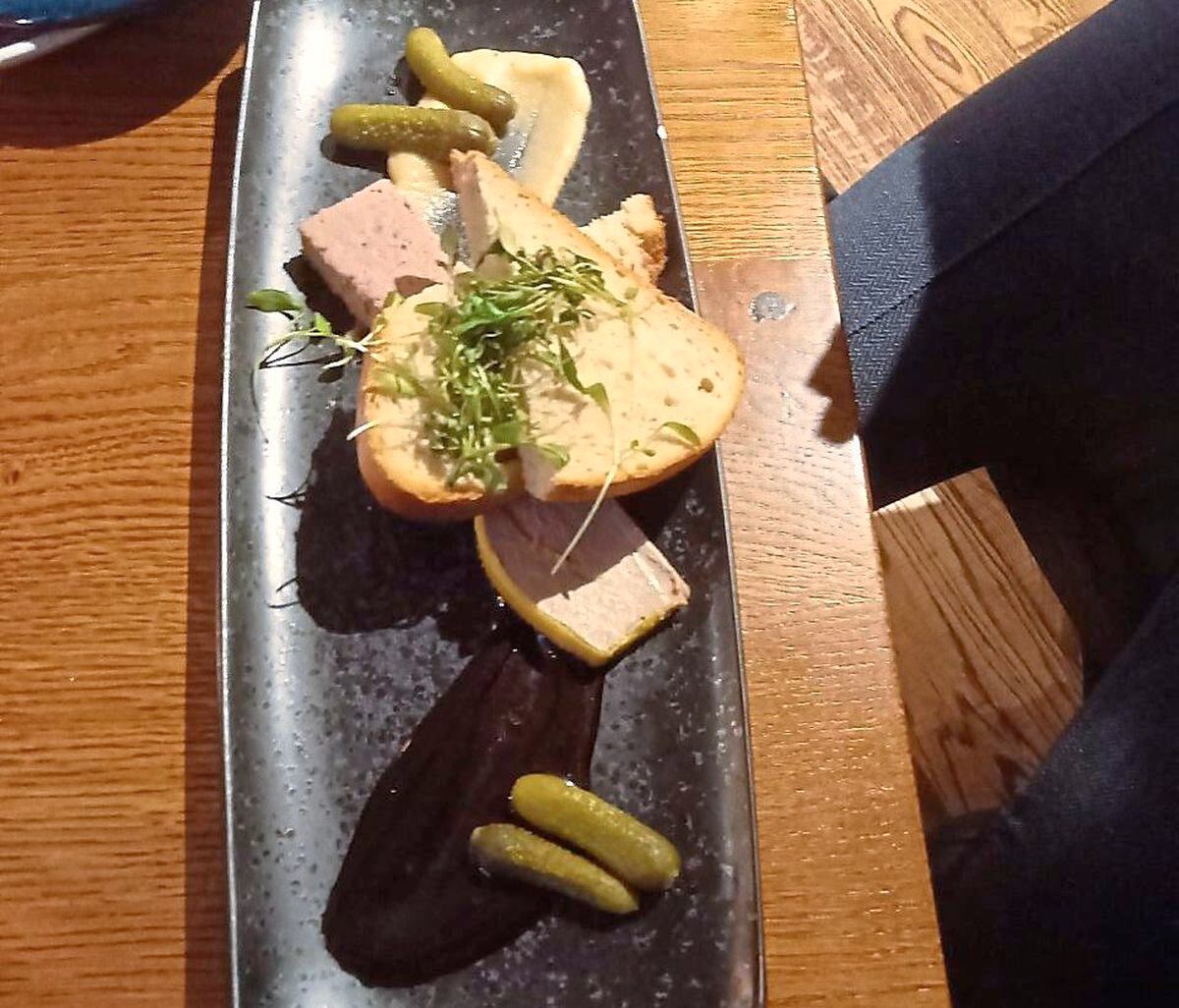 The duo of pâté with sourdough bread and gherkins