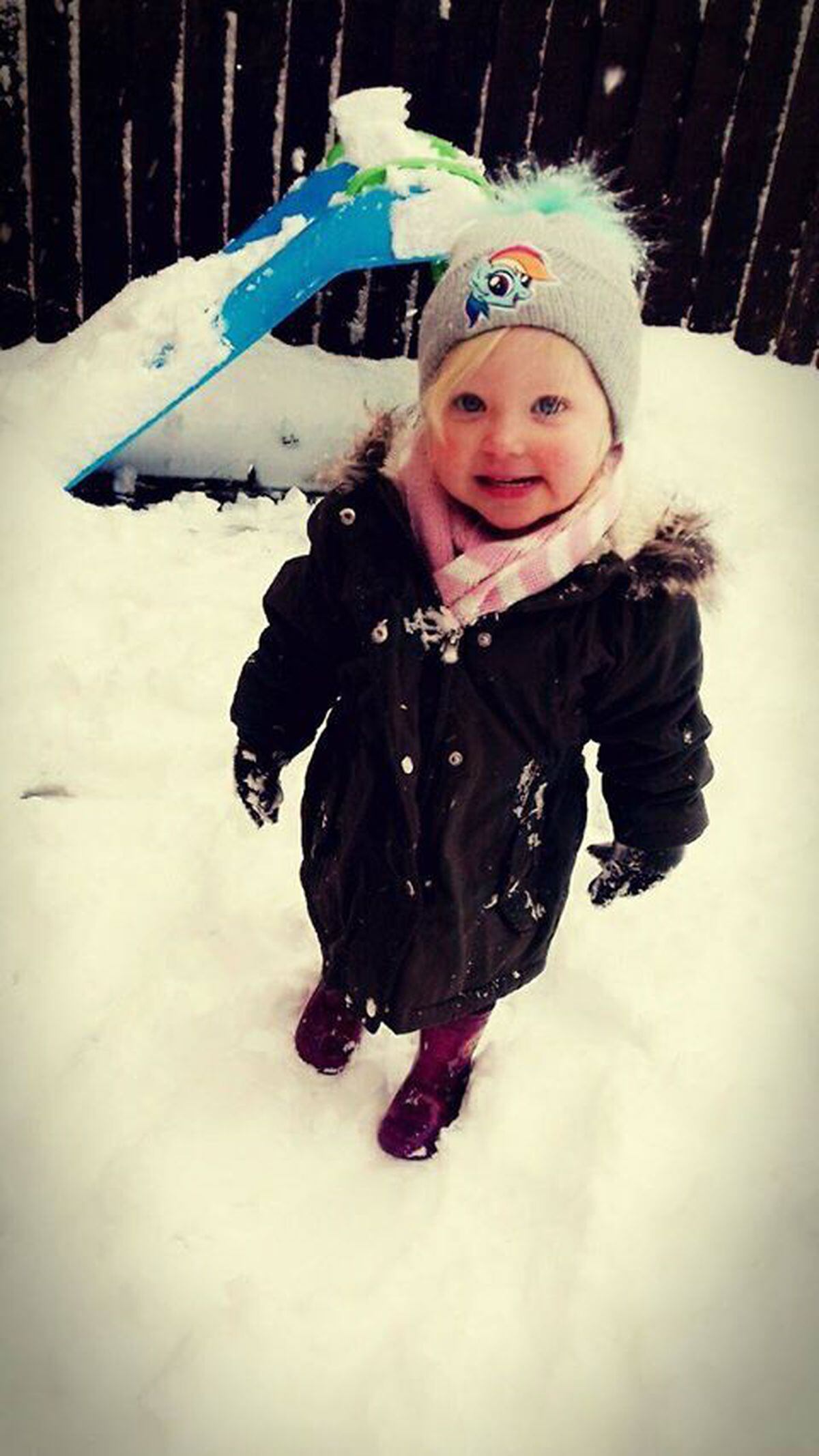 It is the first time Lexi, aged 2, from Oldbury has seen snow. Picture: Shaun Harrison