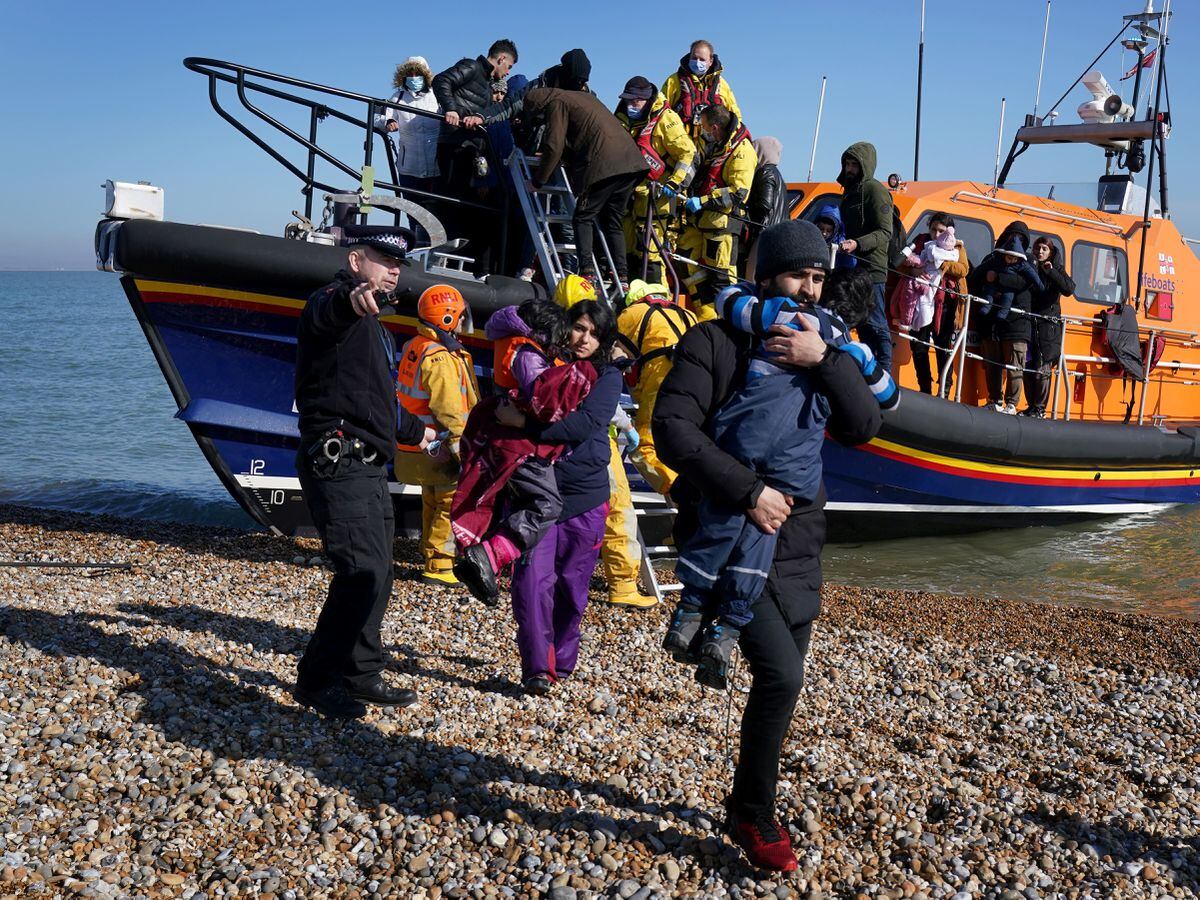 A group of people thought to be migrants including young children are brought in to Dungeness, Kent, by the RNLI following a small boat incident in the Channel