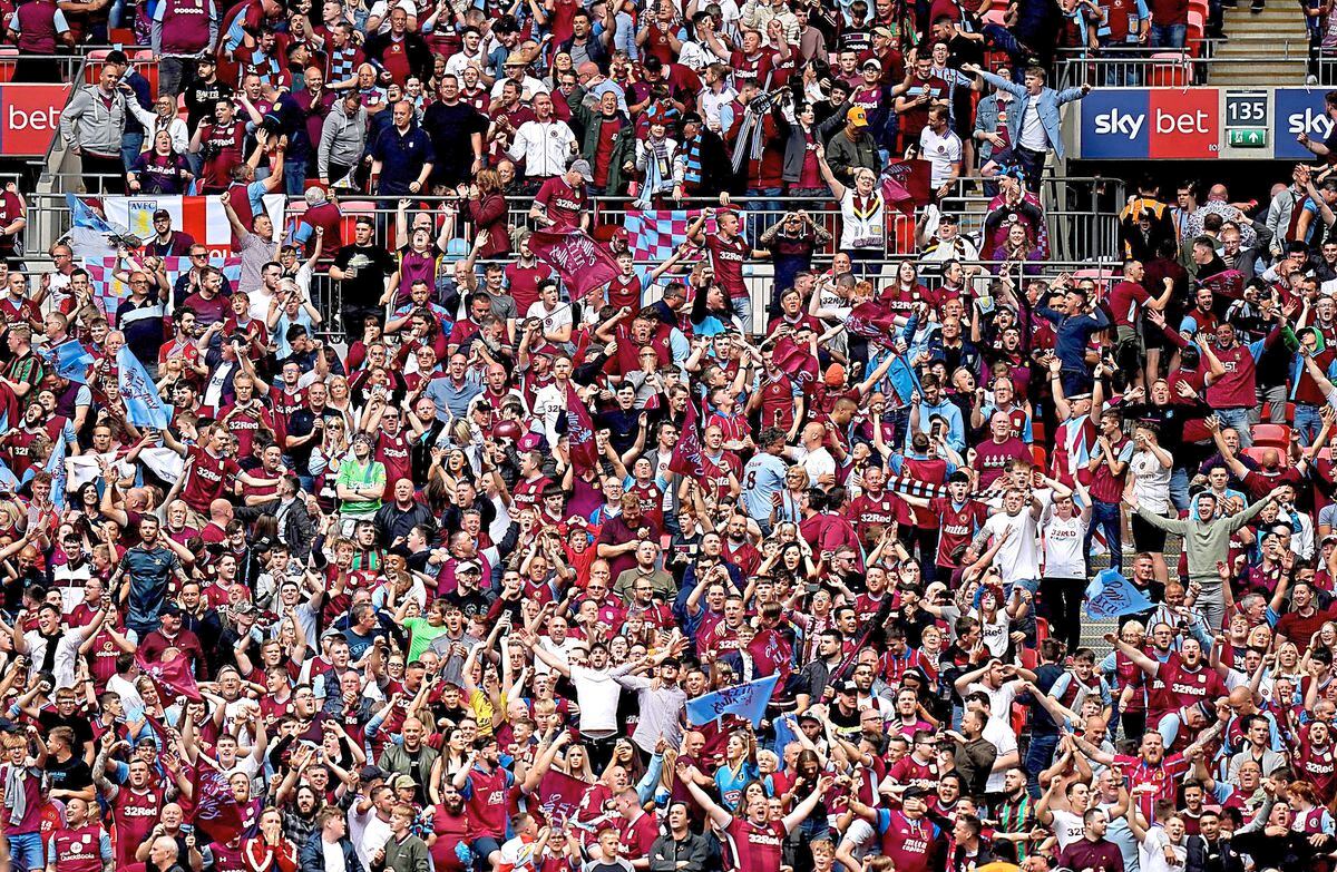 Aston Villa fans in the stands celebrate as Aston Villa's Anwar El Ghazi (not in frame) scores their side's first goal of the game during the Sky Bet Championship Play-off final at Wembley Stadium, London.