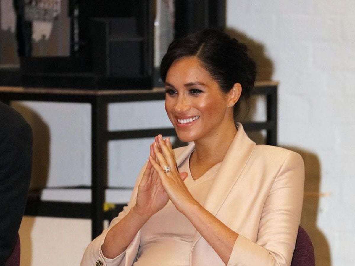 In Pictures: Beaming Meghan steals show at National Theatre | Express ...
