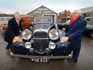Lowell Williams, Chairman of the Black Country Living Museum Trust and Alex Patrick CBE, polish the 1939 Alvis Speed 25 classic car