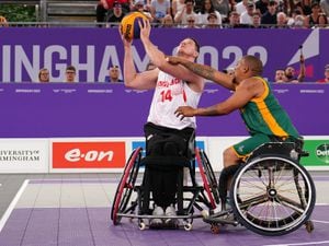 England's Lee Manning shoots past South Africa's Simanga Mbhele, during the Wheelchair Basketball Pool A game against Kenya, at Smithfield on day one of 2022 Commonwealth Games in Birmingham. Picture date: Friday July 29, 2022. PA Photo. See PA story COMMONWEALTH Basketball. Photo credit should read: Martin Rickett/PA Wire...RESTRICTIONS: Use subject to restrictions. Editorial use only, no commercial use without prior consent from rights holder..
