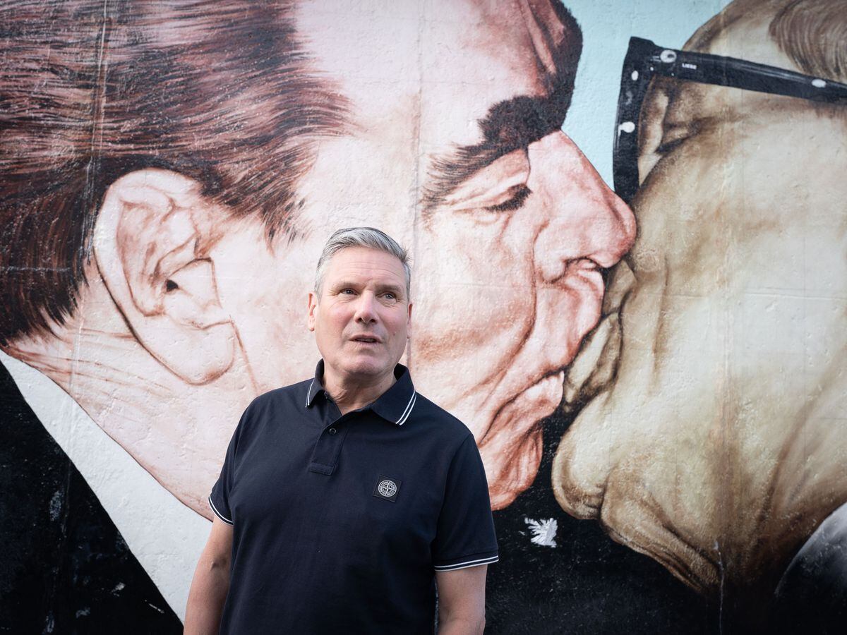 Labour leader Sir Keir Starmer walks past a section of the Berlin Wall known as the East Side Gallery in Berlin