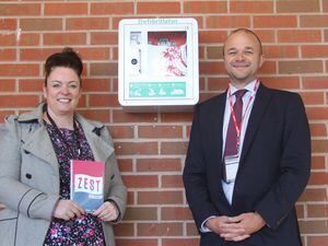 Arthur Terry Headteacher Samantha Kibble with Zest Education’s Brad Johnson and one of the new defibrillators at the school.