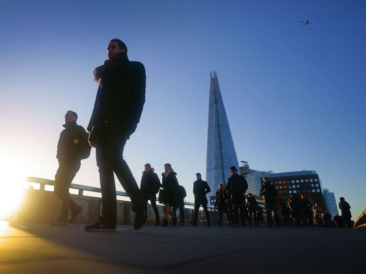 Commuters on London Bridge during the morning rush hour