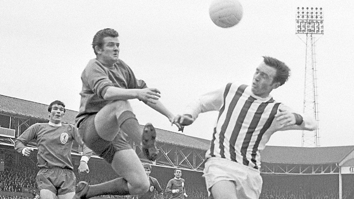 Tommy Lawrence, the Liverpool goalkeeper, is beaten to the ball by Astle