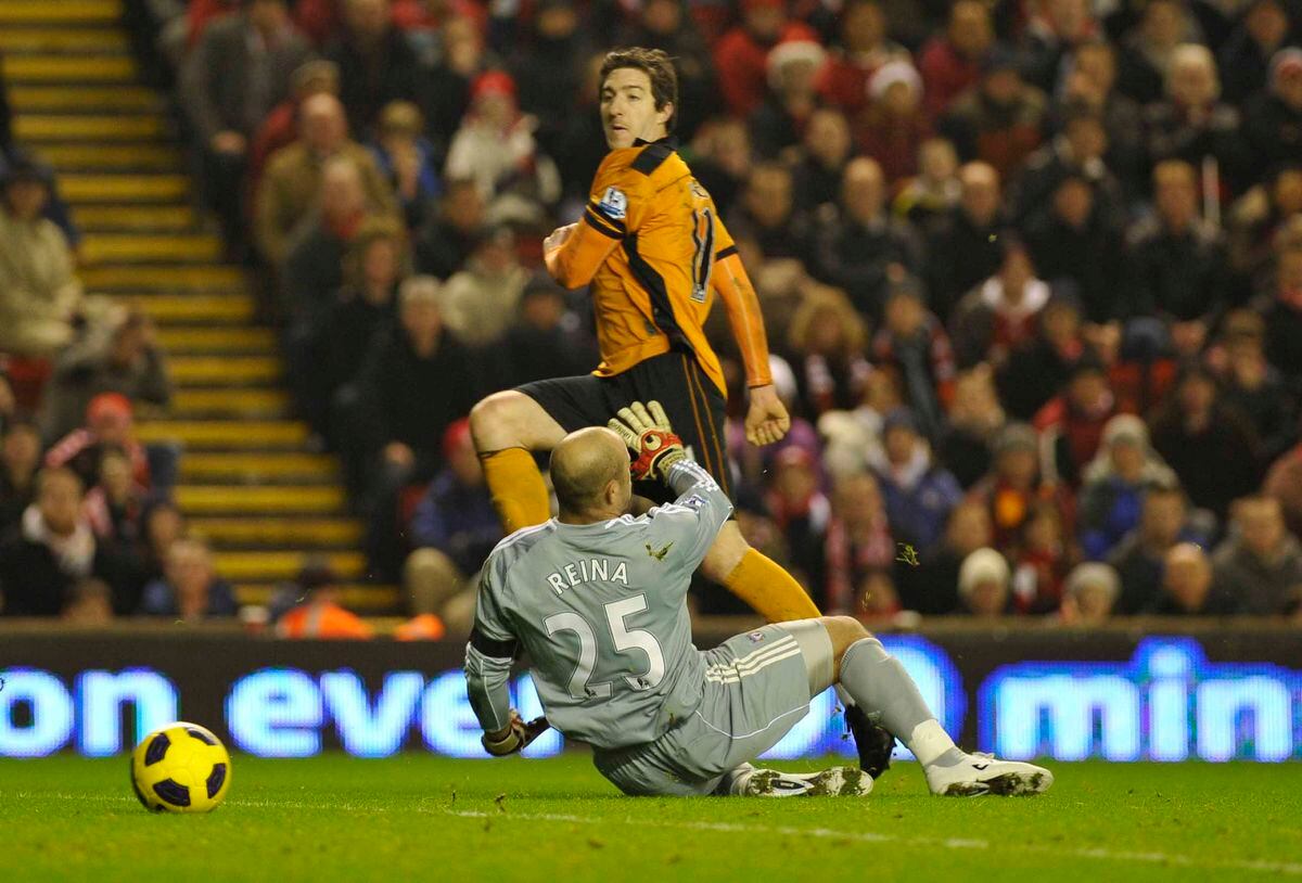Stephen Ward scores the winer for Wolves, prodding the ball past Pepe Reina.Liverpool v Wolves
