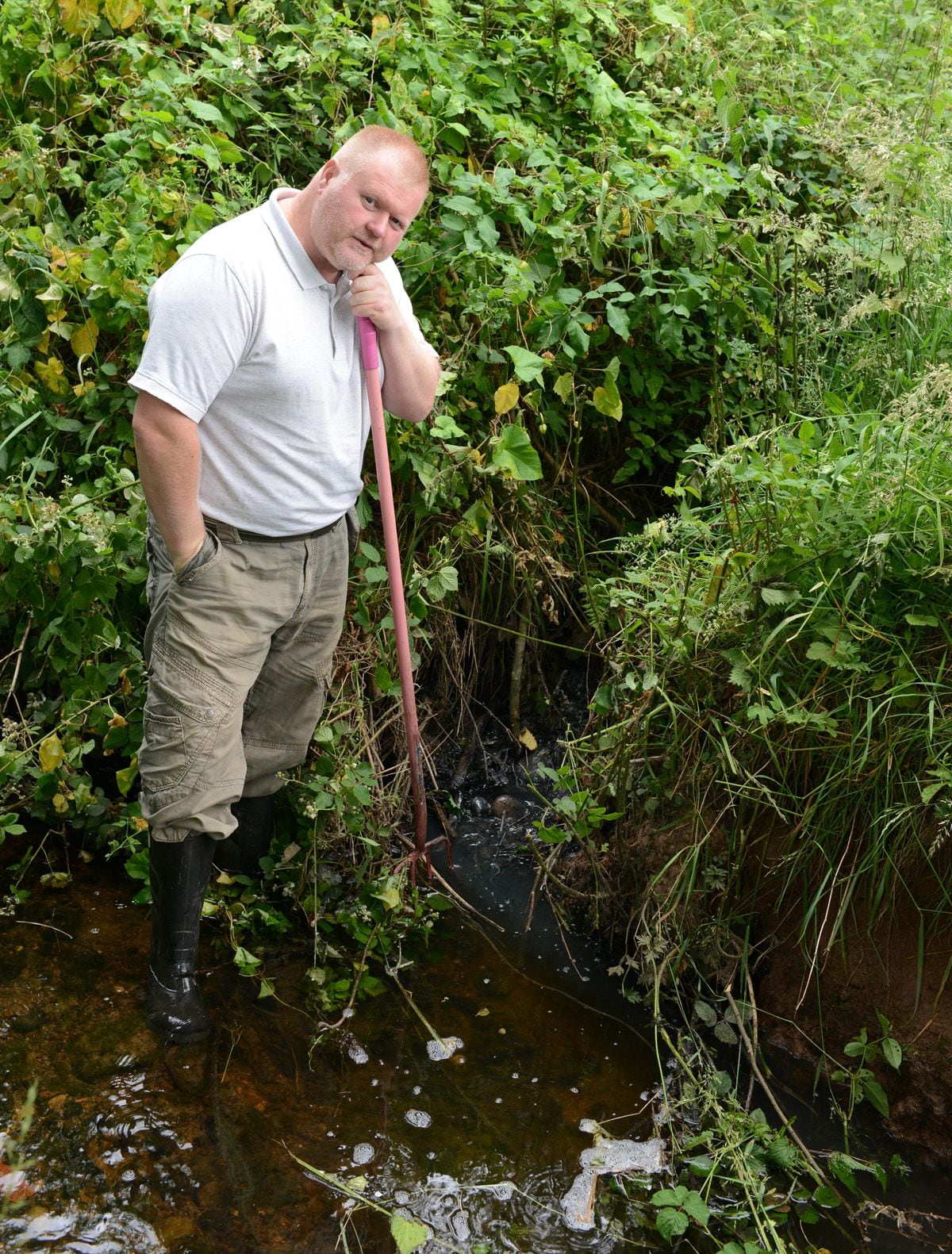 Edward Hughes from Pencroft Lane who has reported raw sewage entering a brook at the bottom of his garden.  The grey sewage entering the brook..