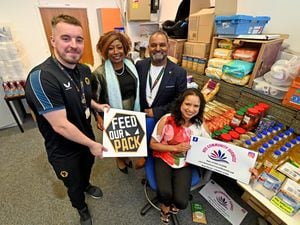 Seema Rayat, Founder of NDS Community Services (seated front) with Ollie Locker project manager at Wolves Food and Poverty Project, former mayor Sandra Samuels, and project manager Serju Patel