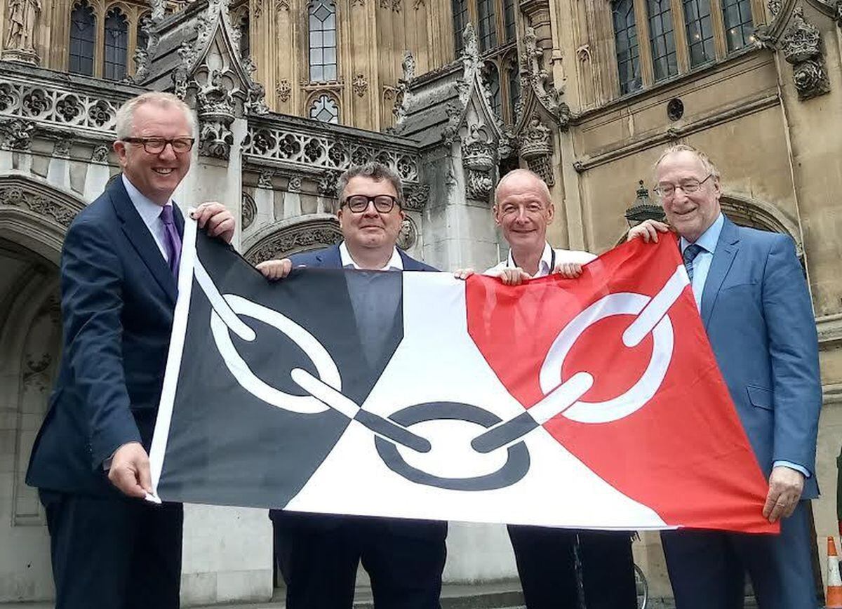 Black Country Labour MPs Ian Austin, Tom Watson, Pat McFadden and Adrian Bailey with the flag at the Houses of Parliament