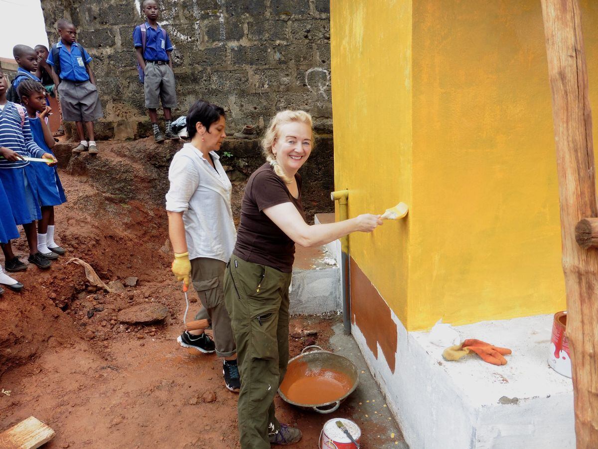 At a school in Kissi area of Freetown, helping with building and painting of extra toilets at the school. 