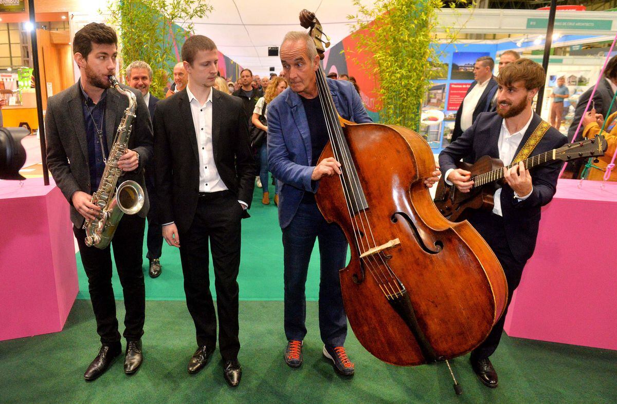 Kevin McCloud and musicians James Owston, Dan Spirrett and Aidan Cope lead the opening of Grand Designs Live at the NEC