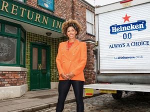 Dr Zoe Williams outside the Rovers Return pub on Coronation Street, next to a van featuring alcohol-free Heineken 0.0.
