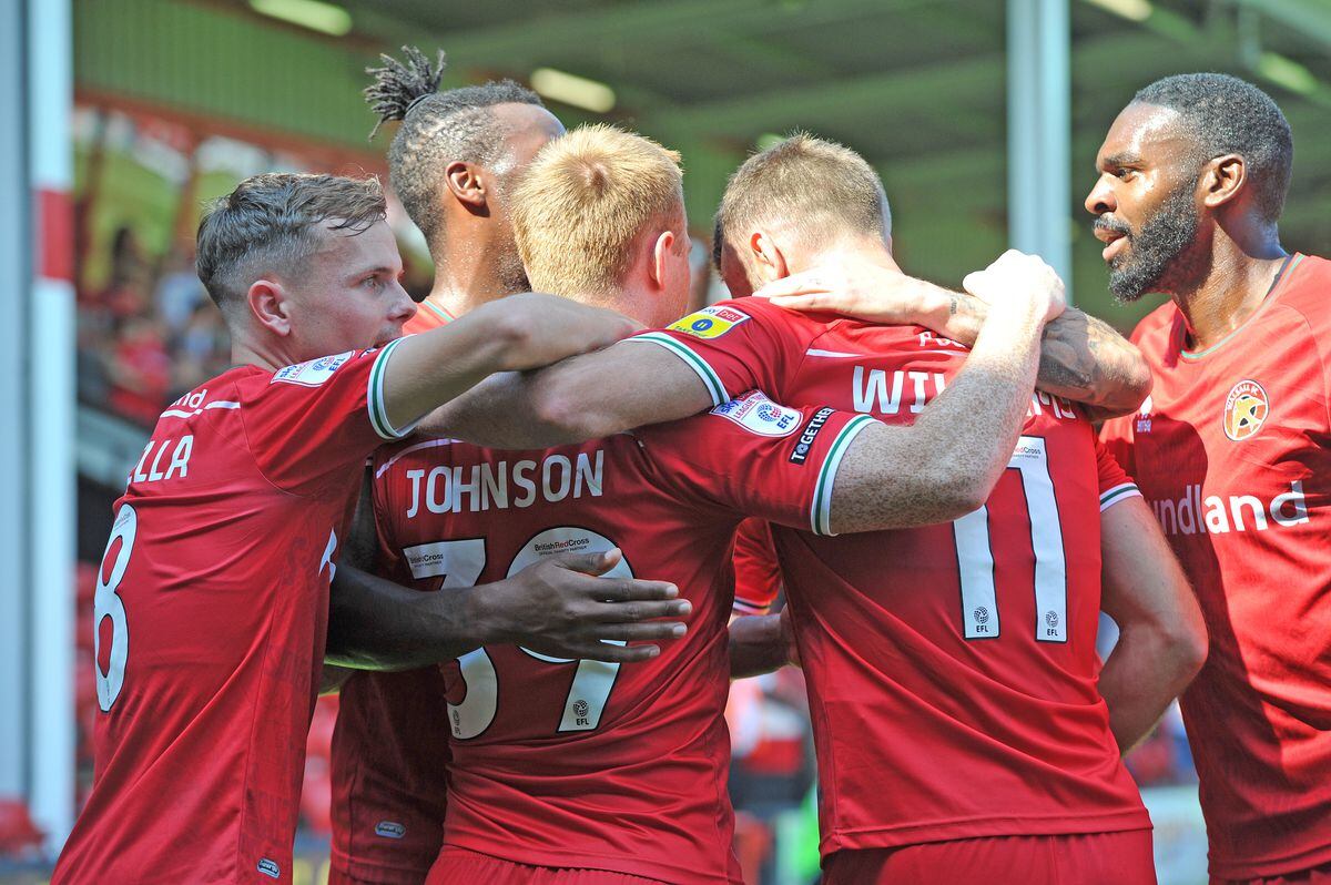 Walsall players celebrate Danny Johnson's opener