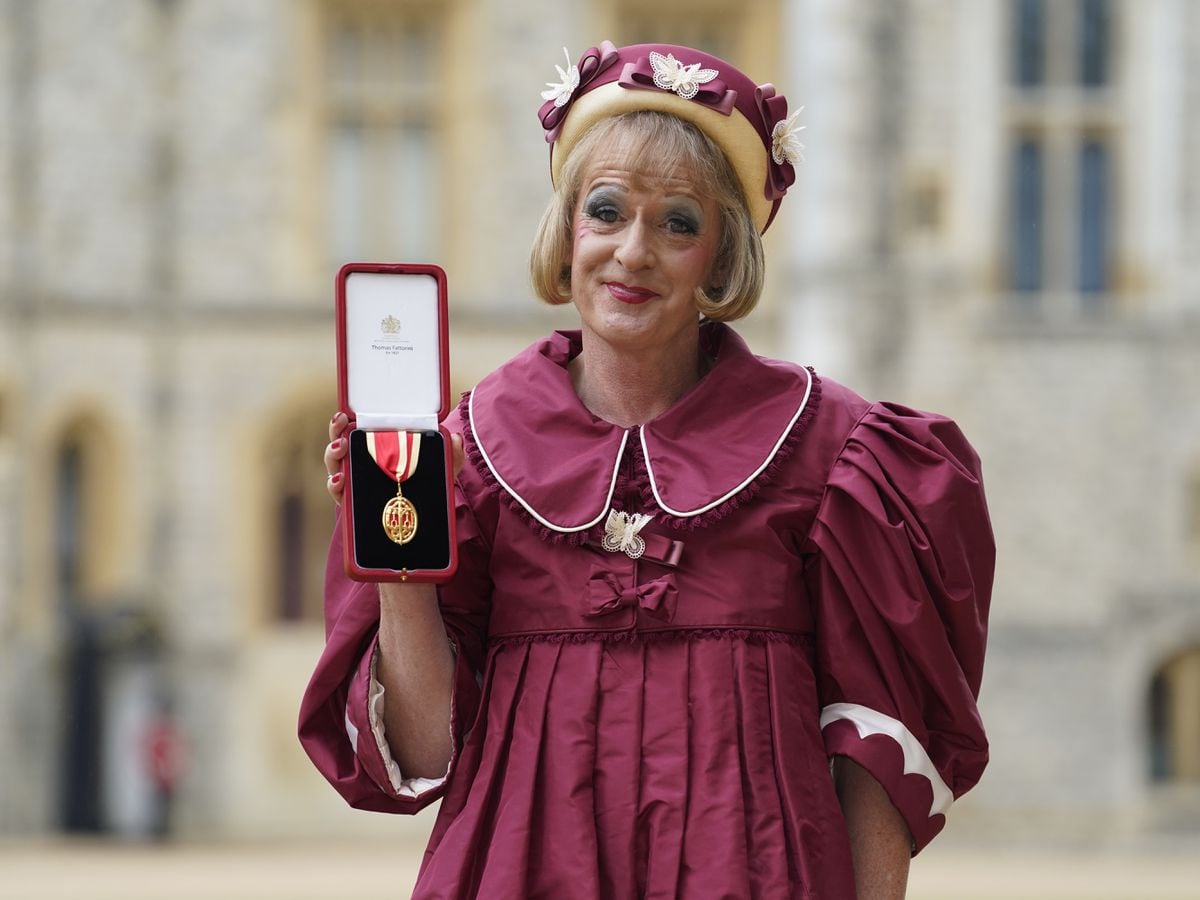 Grayson Perry accepts knighthood in burgundy taffeta dress in honour of ...