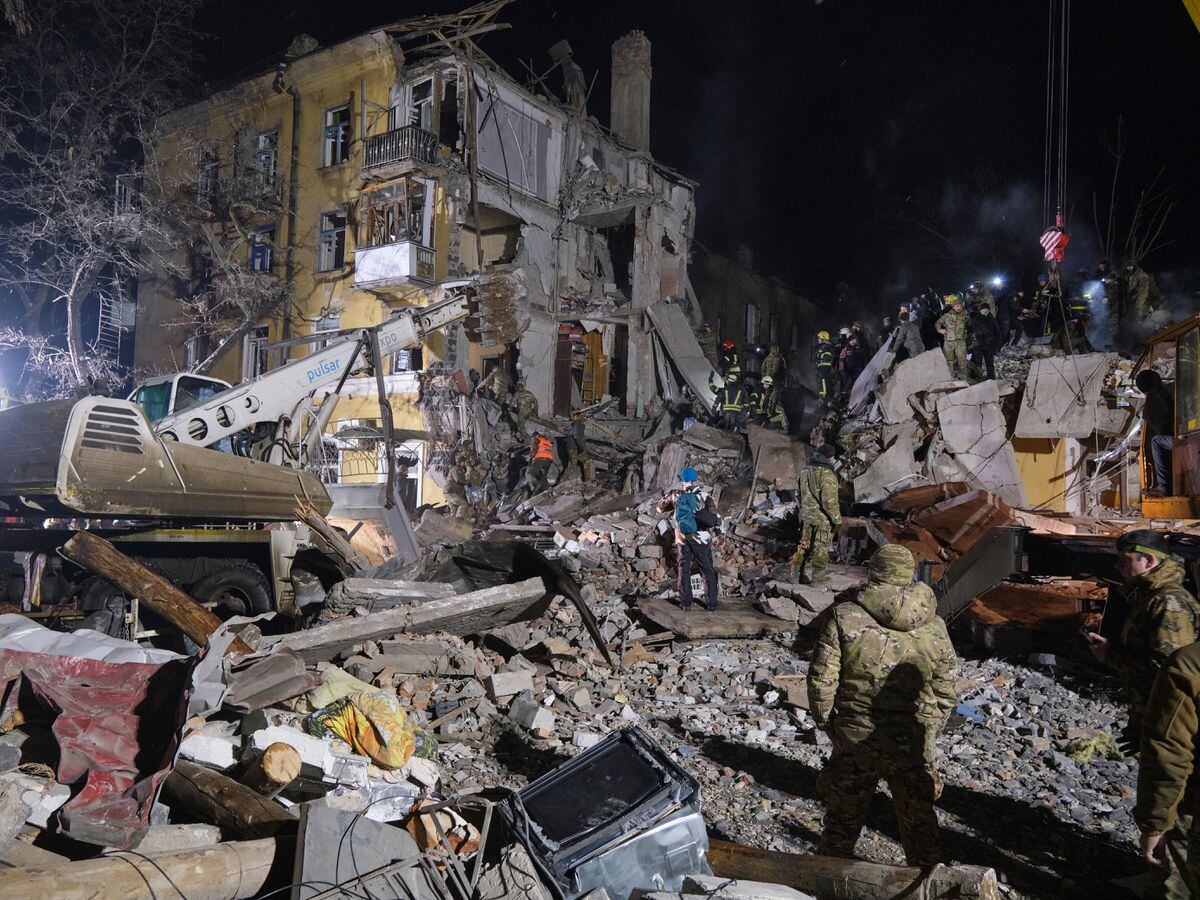 Emergency workers clear the rubble after a Russian rocket hit an apartment building in Kramatorsk, Ukraine, on Thursday February 2 2023