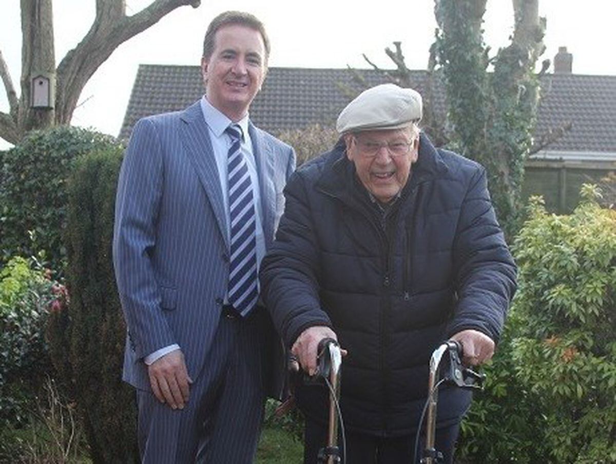 98-year-old Harold Jones with Mike Jordan, in the garden where the former soldier has walked more than 300 miles for the Motor Neurone Disease Association