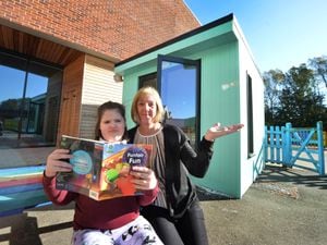 Next to one of the new learning pods at Tettenhall Wood School is teaching assistant Dawn Anderson, with one of the pupils.