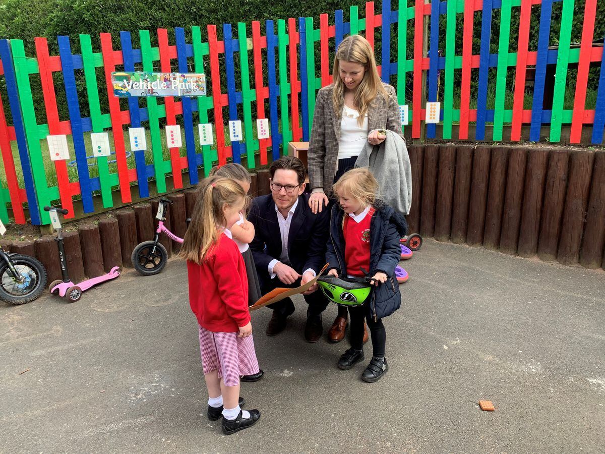 Viscount Alexander Newport with his fiancee Eliza Liepina with the pupils at St John's First School in Bishops Wood in their new outdoor learning area