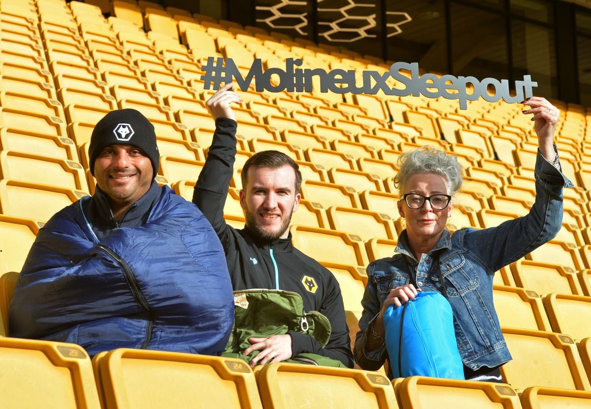 Getting ready for the Molineux Sleepout, members of the Good Shepherd (left) Daniel Turner, and (right) Dawn Walls, with (centre) senior communication officer Scott Brotherton, at the Molineux Stadium, Wolverhampton..